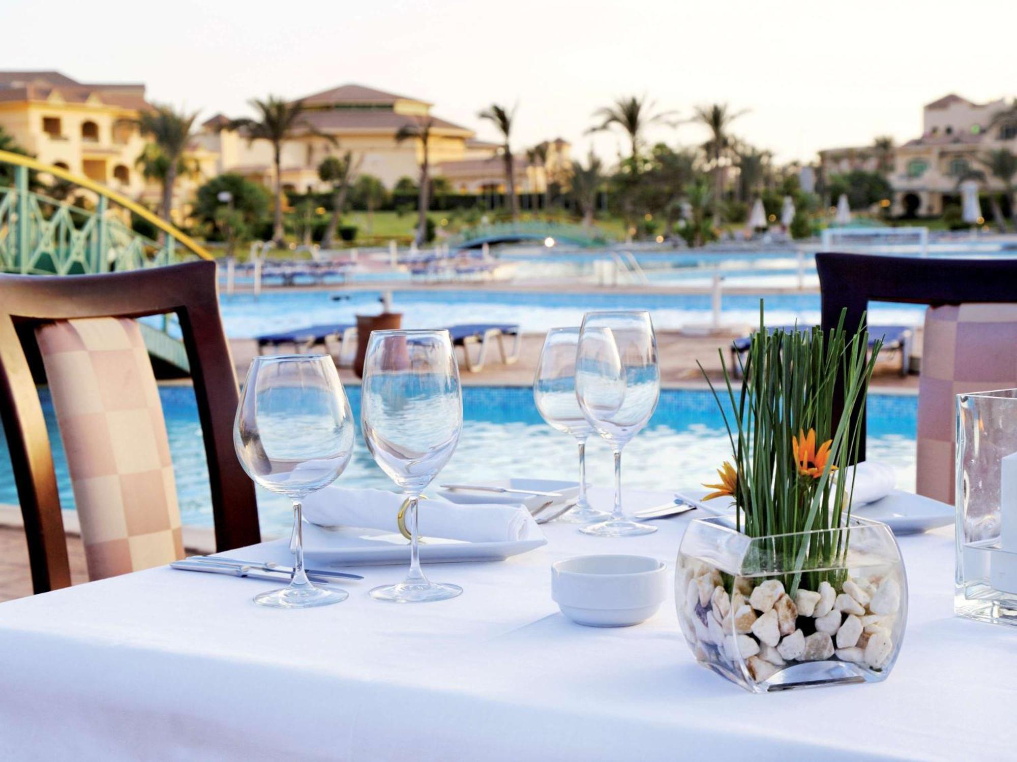 Moevenpick Hotel Cairo - Media City Giza Экстерьер фото The pool at the resort